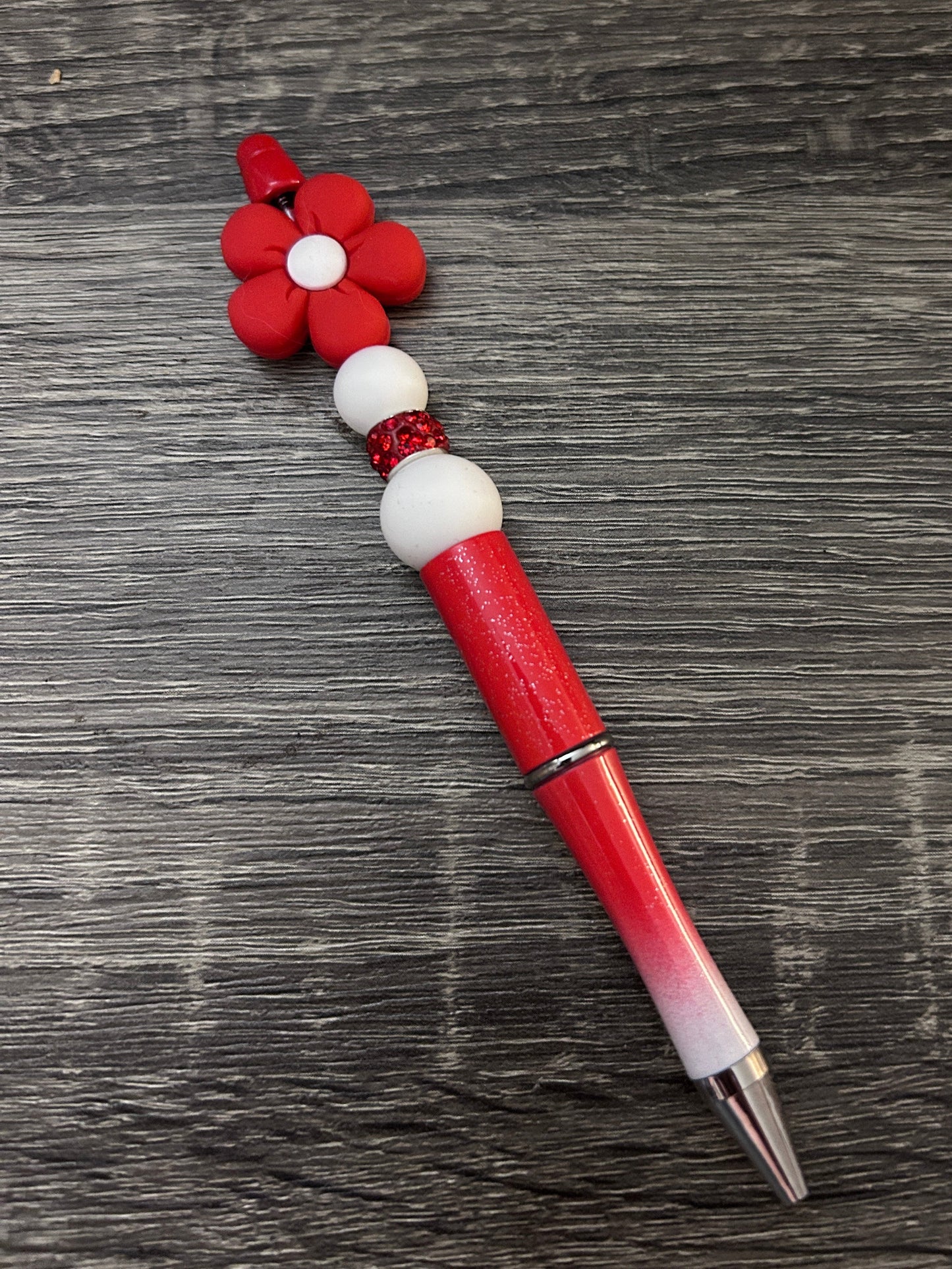 Red "flower power" pen with red/white barrel